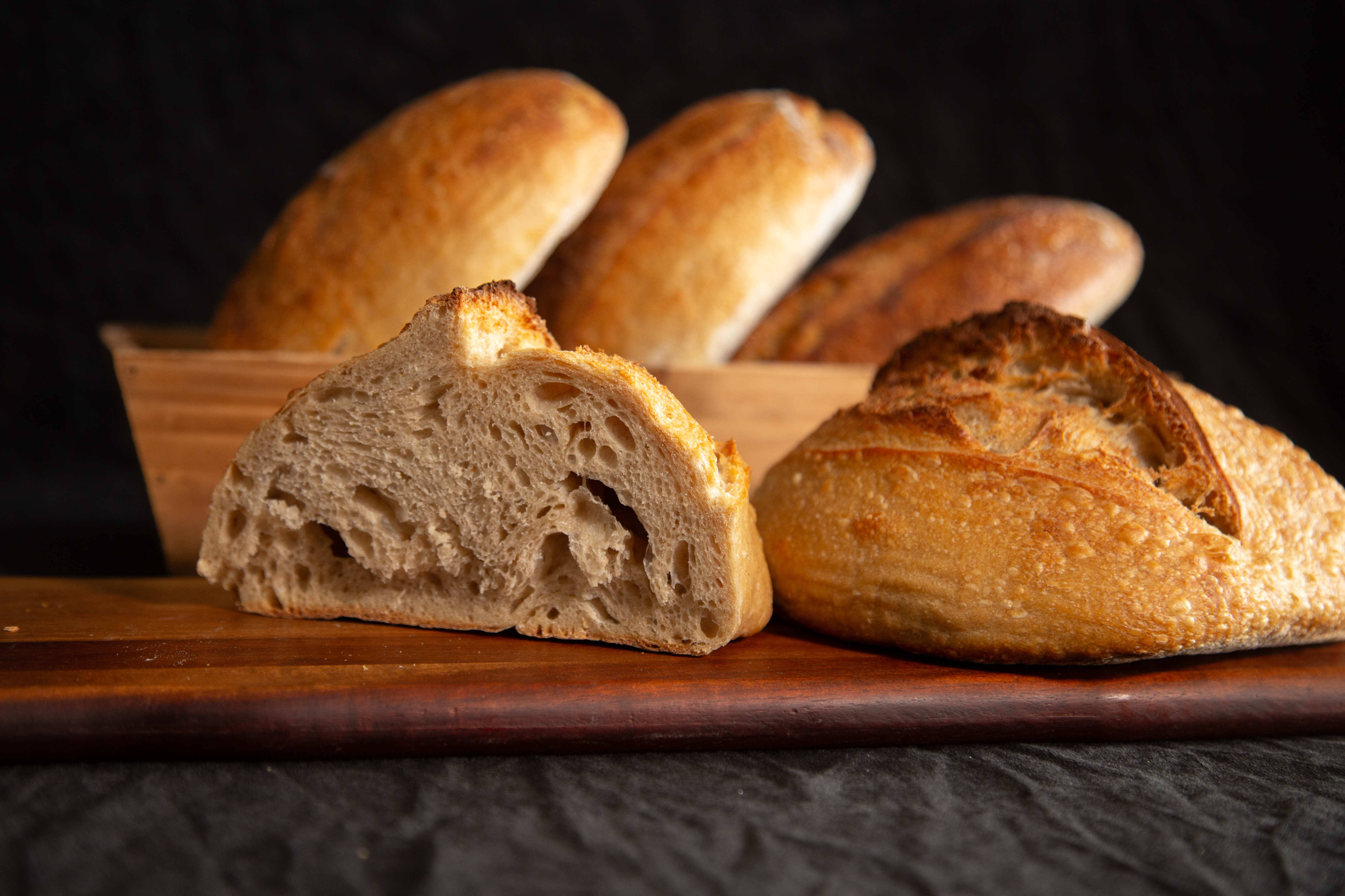 Artisan bread loaves on wooden board
